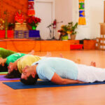 Students do the Fish Pose in the Yoga Hall